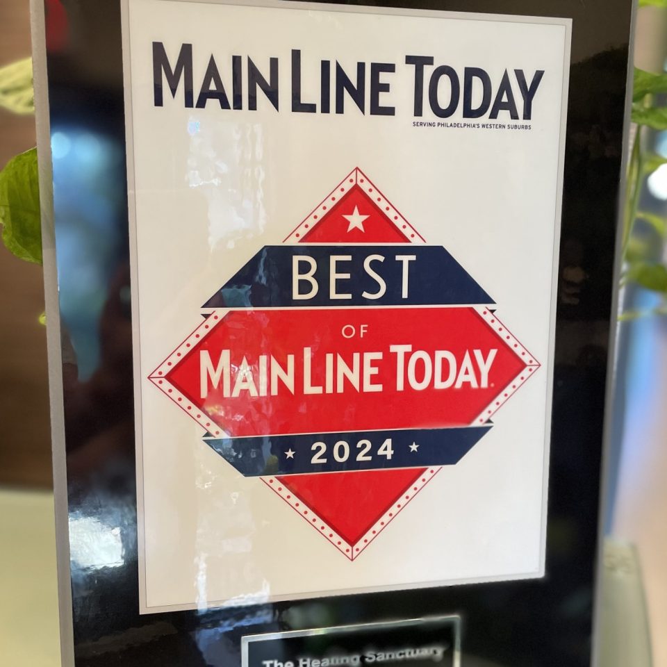 A framed certificate titled "Main Line Today" with a banner stating "Best of Main Line Today 2024." Below, an engraved plaque reads "The Healing Sanctuary, Mind/Body Programs." The frame is set against a background of green leaves.