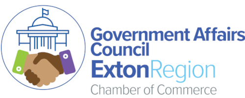 Logo of the Exton Region Chamber of Commerce Government Affairs Council, featuring two hands shaking and a government building icon within a circle, with the council's name written to the right.